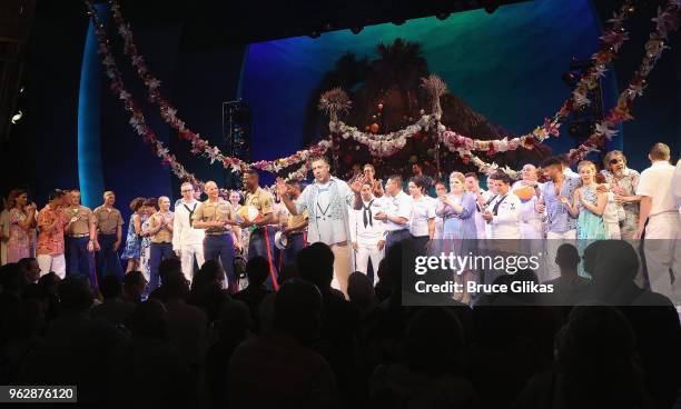 Members of the United States Military join the cast of the Jimmy Buffett Broadway Musical "Escape to Margaritaville" onstage to celebrate Memorial...