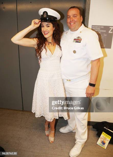 Members of the United States Military pose with Alison Luff of the cast of the Jimmy Buffett Broadway Musical "Escape to Margaritaville" backstage to...