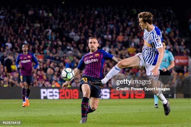 Paco Alcacer Garcia of FC Barcelona fights for the ball with Diego Javier Llorente of Real Sociedad during the La Liga match between Barcelona and...