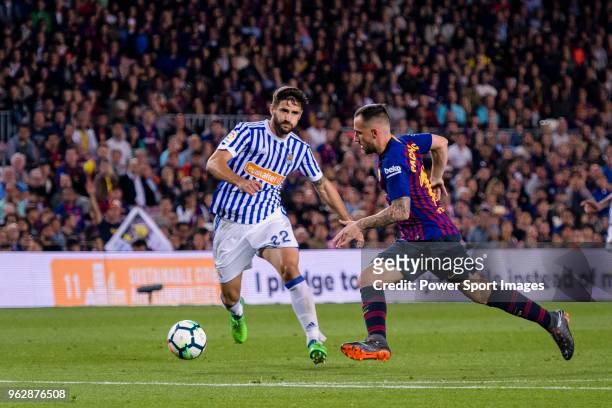 Paco Alcacer Garcia of FC Barcelona fights for the ball with Raul Rodriguez Navas of Real Sociedad during the La Liga match between Barcelona and...
