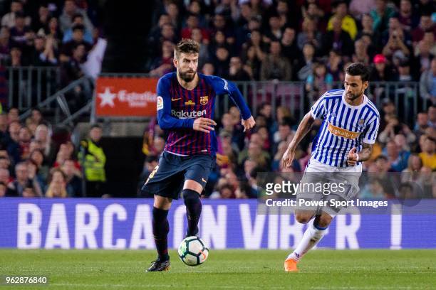 Gerard Pique Bernabeu of FC Barcelona in action against Willian Jose da Silva of Real Sociedad during the La Liga match between Barcelona and Real...