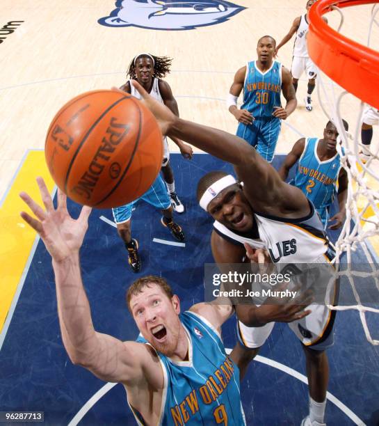 Zach Randolph of the Memphis Grizzlies rebounds the ball against Darius Songalia of the New Orleans Hornets on January 30, 2010 at FedExForum in...