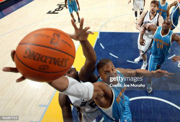 David West of the New Orleans Hornets and Zach Randolph of the Memphis Grizzlies battle for a rebound on January 30, 2010 at FedExForum in Memphis,...