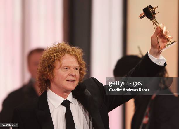 Singer Mick Hucknall lifts up the award during the Goldene Kamera 2010 Award at the Axel Springer Verlag on January 30, 2010 in Berlin, Germany.