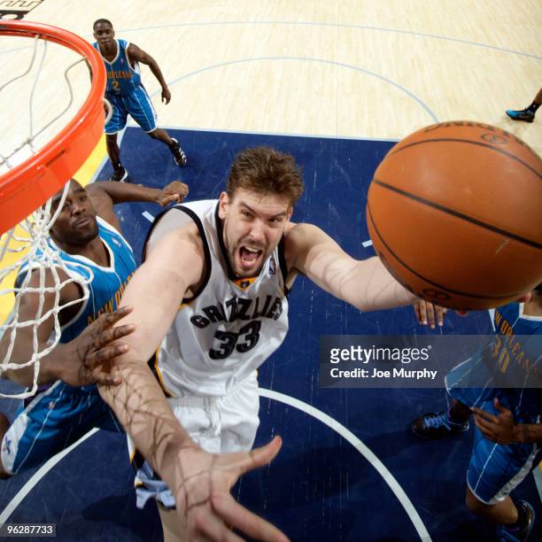 Marc Gasol of the Memphis Grizzlies shoots the ball against Emeka Okafor of the New Orleans Hornets on January 30, 2010 at FedExForum in Memphis,...