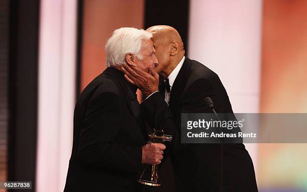 Joachim Fuchsberger recieves the award for 'Lifetime Achievement' from Harry Belafonte during the Goldene Kamera 2010 Award at the Axel Springer...
