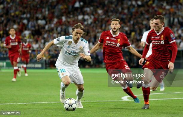 Real Madrid's Luka Modric, left, controls the ball during the final match of the Champions League between Real Madrid and Liverpool at the Olympic...