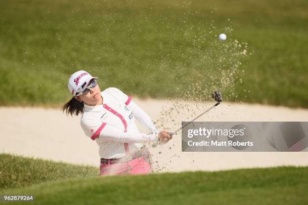 Minami Katsu of Japan hits out of the 18th green bunker during the final round of the Resorttust Ladies at Kansai Golf Club on May 27, 2018 in Miki,...