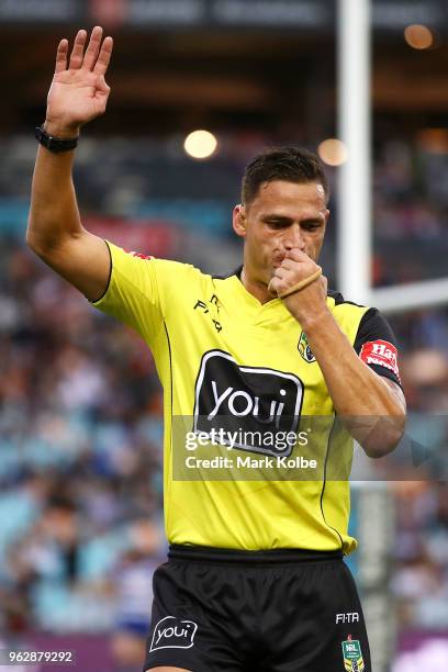 Referee Henry Perenara calls for a review after Mahe Fonua of the Tigers scored a try during the round 12 NRL match between the Wests Tigers and the...