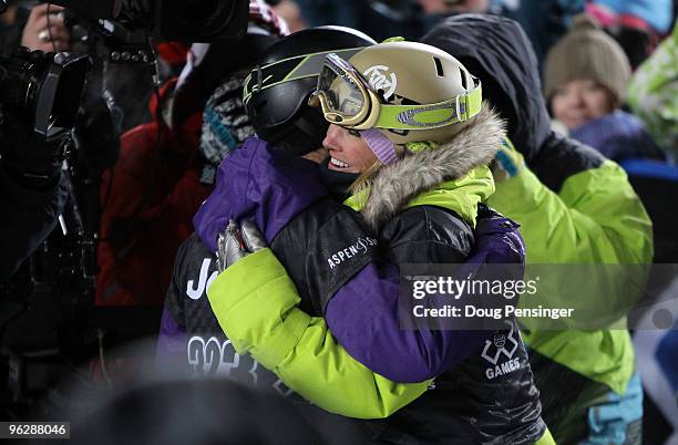 Gretchen Bleiler of Aspen, Colorado gets a hug from second place finisher Kelly Clark of Mount Snow, Vermont as Bleiler won the gold medal in the...