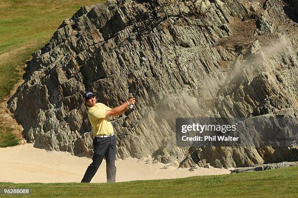 Robert Gates of the USA plays out of a bunker on the 17th hole during day four of the New Zealand Open at The Hills Golf Club on January 31, 2010 in...