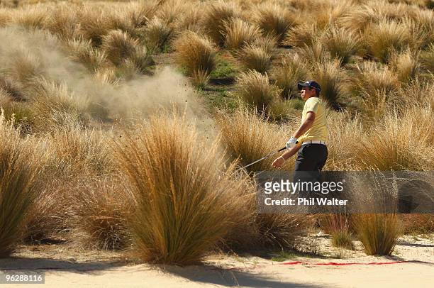 Robert Gates of the USA plays out of the sand on the 17th hole during day four of the New Zealand Open at The Hills Golf Club on January 31, 2010 in...