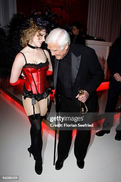 Joachim Fuchsberger jokes with a dancer during the Goldene Kamera 2010 Award at the Axel Springer Verlag on January 30, 2010 in Berlin, Germany.