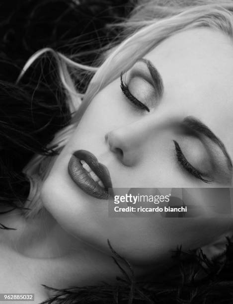 black and white woman portrait with closed eyes and long eyelashes - high key stock pictures, royalty-free photos & images