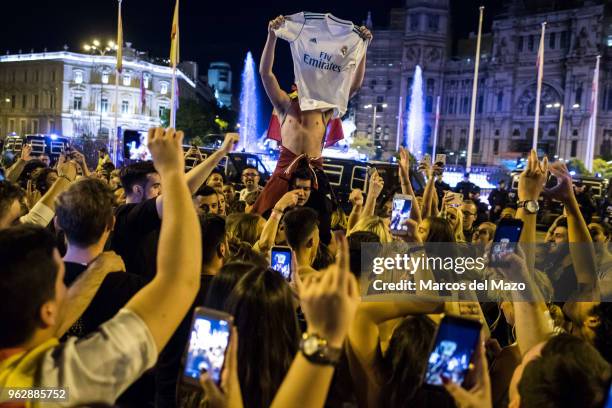 Real Madrid fans celebrating in Cibeles Square after their team won the 13th UEFA Champions League Cup in the final match between Liverpool and Real...