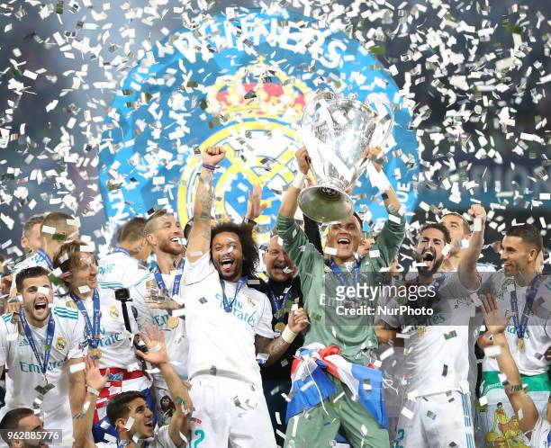 Keylor Navas of Real Madrid celebrates with the UEFA Champions League trophy after his side won the UEFA Champions League final between Real Madrid...