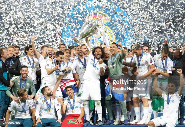 Marcelo of Real Madrid lifts the trophy during the UEFA Champions League final between Real Madrid and Liverpool on May 26, 2018 in Kiev, Ukraine.