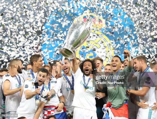 Marcelo of Real Madrid lifts the trophy during the UEFA Champions League final between Real Madrid and Liverpool on May 26, 2018 in Kiev, Ukraine.