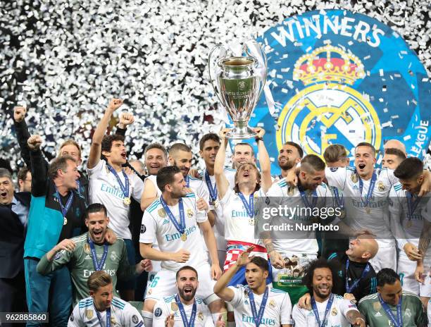 Luka Modric of Real Madrid lifts the trophy during the UEFA Champions League final between Real Madrid and Liverpool on May 26, 2018 in Kiev, Ukraine.