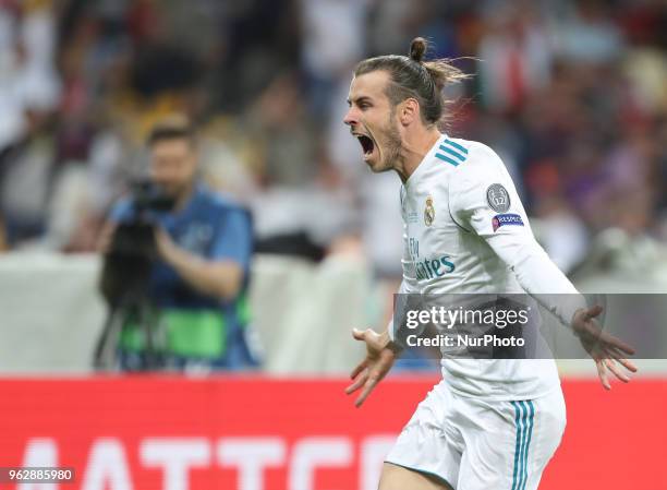 Gareth Bale of Real Madrid celebrates scoring his side's second goal during the UEFA Champions League Final between Real Madrid and Liverpool at NSC...