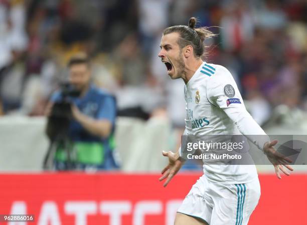 Gareth Bale of Real Madrid celebrates scoring his side's second goal during the UEFA Champions League Final between Real Madrid and Liverpool at NSC...
