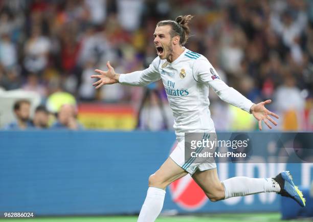 Gareth Bale of Real Madrid celebrates scoring his side's second goal during the UEFA Champions League Final between Real Madrid and Liverpool at NSC...