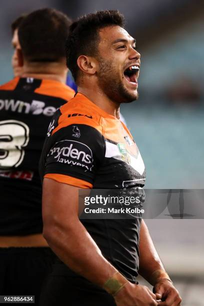 David Nofoaluma of the Tigers celebrates victory during the round 12 NRL match between the Wests Tigers and the Canterbury Bulldogs at ANZ Stadium on...