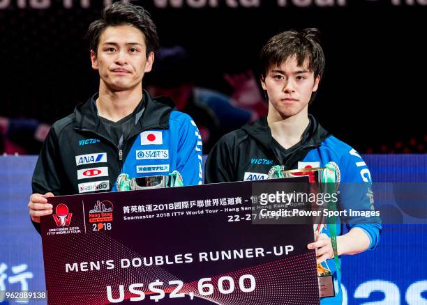 Masataka Morizono and Yuya Oshima of Japan pose with their prize after finishing the men's doubles - final match against Ho Kwan Kit and Wong Chun...