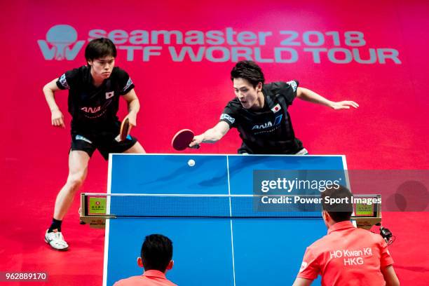 Masataka Morizono and Yuya Oshima of Japan competes against Ho Kwan Kit and Wong Chun Ting of Hong Kong during the men's doubles - final match of...