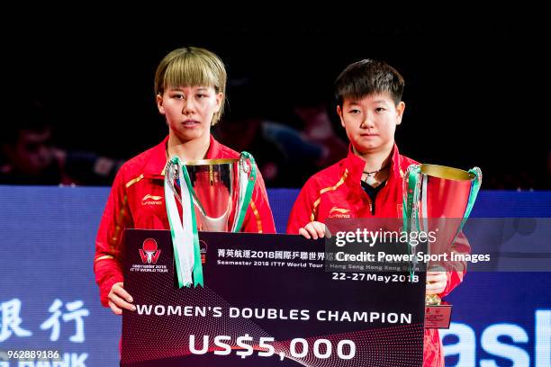 Chen Xingtong and Sun Yingsha of China pose with their prize after finishing against during women's doubles - final match against Chen Ke and Wang...