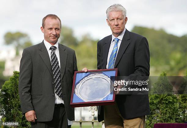 Peter McKay , trainer of Joey Massino receives the winning shield for the New Zealand Bloodstock Insurance Karaka 3 year old Mile from Jim Bruford of...
