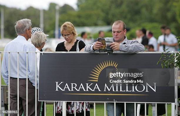 Punter reads over the race book during the Karaka Million at Ellerslie Racecource on January 31, 2010 in Auckland, New Zealand.