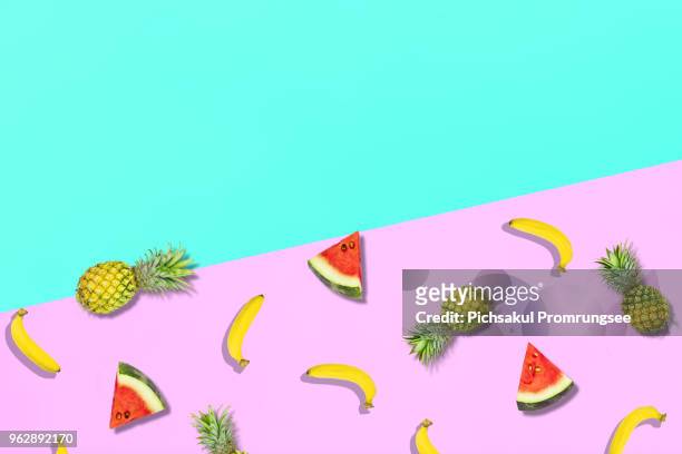 High Angle View Of Fruits Over Colored Background
