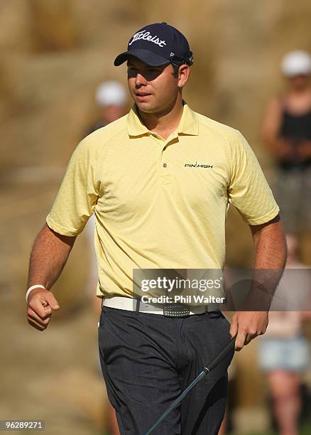 Robert Gates of the USA celebrates sinking the winning putt on the 18th green during day four of the New Zealand Open at The Hills Golf Club on...