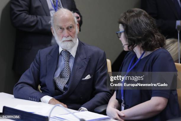 Prince Michael of Kent speaks to a woman, half length, at the United Nations headquarters in New York City, New York, April 12, 2018.