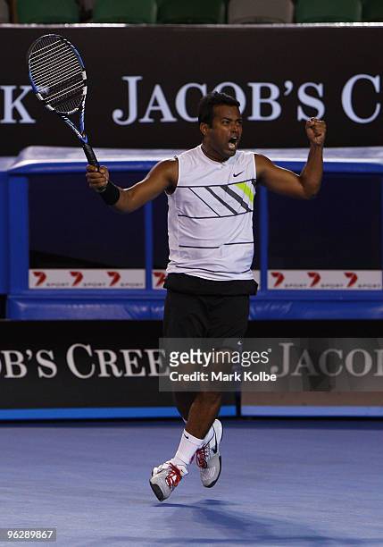 Leander Paes of India celebrates winning championship point in his mixed doubles finals match with Cara Black of Zimbabwe against Ekaterina Makarova...