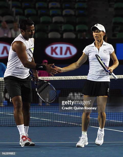 Cara Black of Zimbabwe and Leander Paes of India celebrate winning a point in their mixed doubles final match against Ekaterina Makarova of Russia...