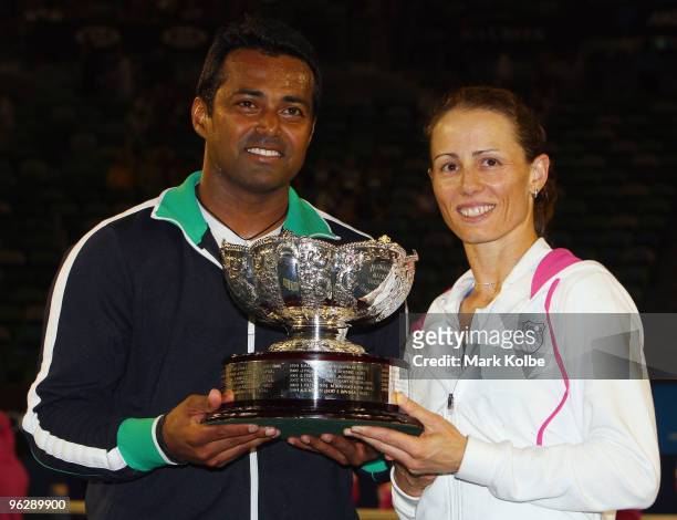 Leander Paes of India and Cara Black of Zimbabwe pose with the championship trophy after their mixed doubles final match against Ekaterina Makarova...