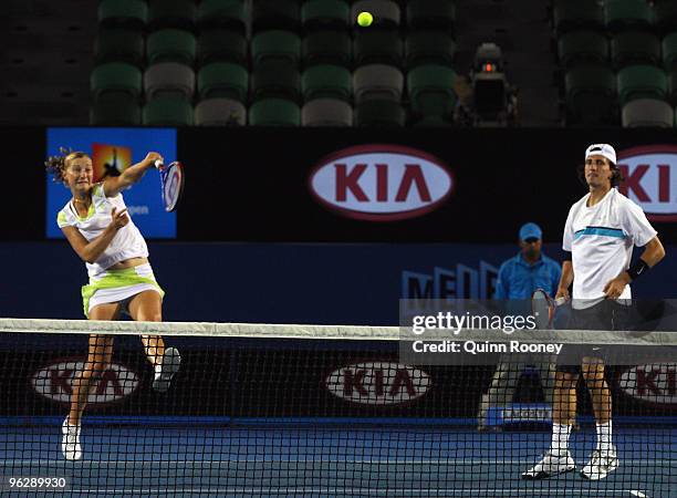 Ekaterina Makarova of Russia serves in her mixed doubles final match with Jaroslav Levinsky of the Czech Republic against Cara Black of Zimbabwe and...