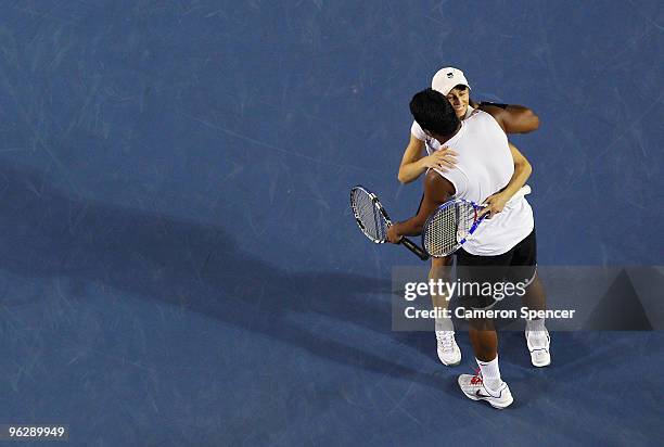 Cara Black of Zimbabwe and Leander Paes of India celebrate championship point in their mixed doubles final match against Ekaterina Makarova of Russia...