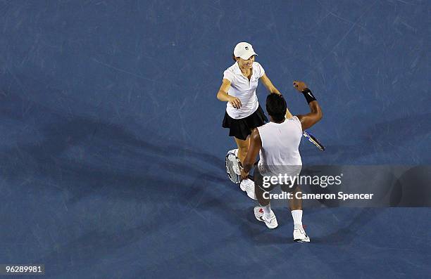 Cara Black of Zimbabwe and Leander Paes of India celebrate championship point in their mixed doubles final match against Ekaterina Makarova of Russia...