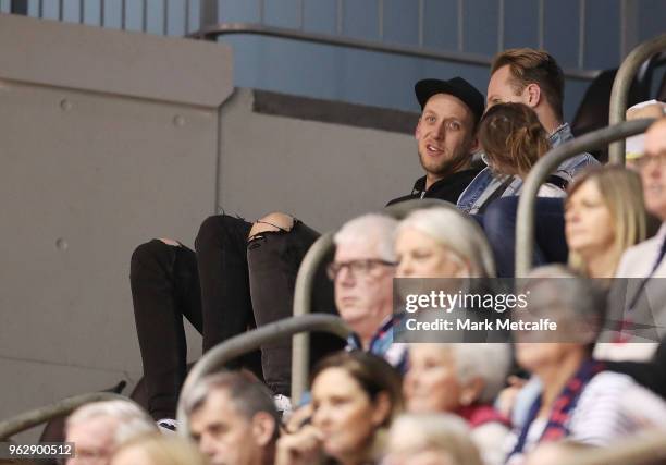 Joe Ingles watches the round five Super Netball match between the Giants and the Vixens at Quay Centre on May 27, 2018 in Sydney, Australia.