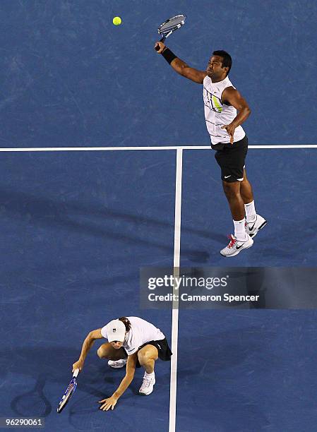 Leander Paes of India plays a forehand in his mixed doubles final match with Cara Black of Zimbabwe against Ekaterina Makarova of Russia and Jaroslav...