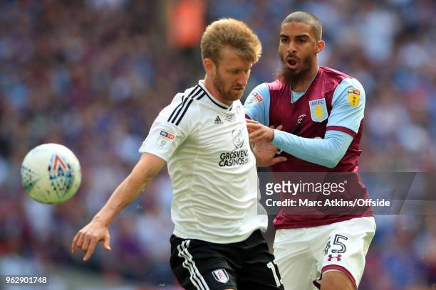 Lewis Grabban of Aston Villa in action with Tim Ream of Fulham during the Sky Bet Championship Play Off Final between Aston Villa and Fulham at...