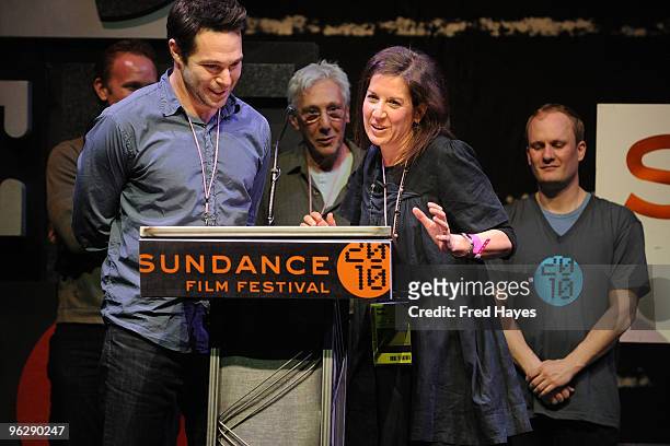 Producer Adam Schlesinger and producer Linda Saffire accept the Directing Award for Documentary for "Smash His Camera" onstage at the Awards Night...