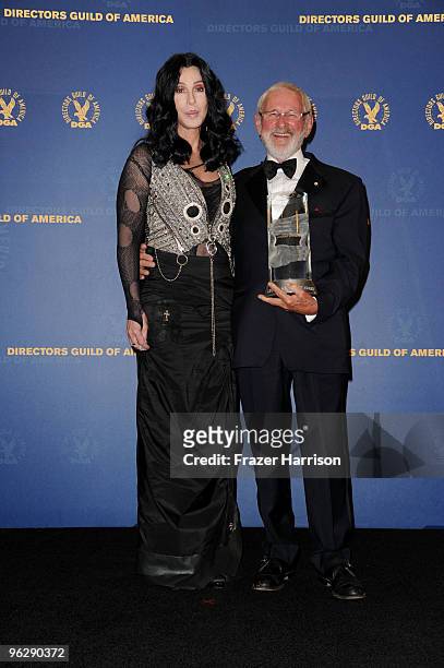 Director Norman Jewison, winner of the Lifetime Achievment Award, poses in the press room with singer Cher during the 62nd Annual Directors Guild Of...