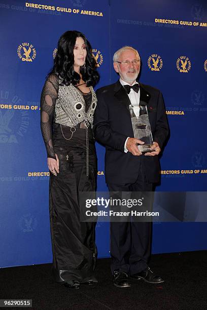 Director Norman Jewison, winner of the Lifetime Achievment Award, poses in the press room with singer Cher during the 62nd Annual Directors Guild Of...