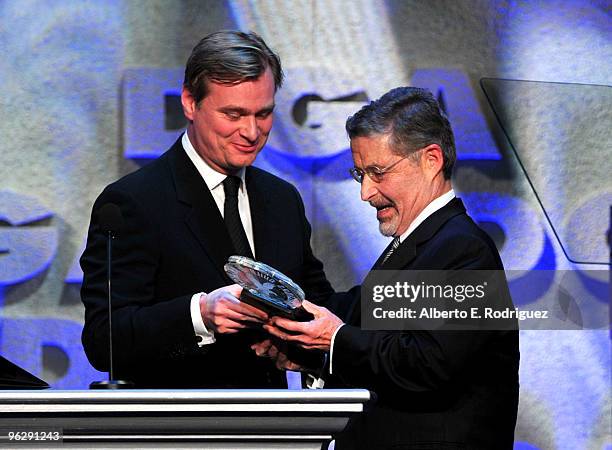 Chairman and CEO of Warner Bros. Entertainment Inc. Barry Meyer accepts the DGA Honorary Life Membership onstage from filmmaker Christopher Nolan...