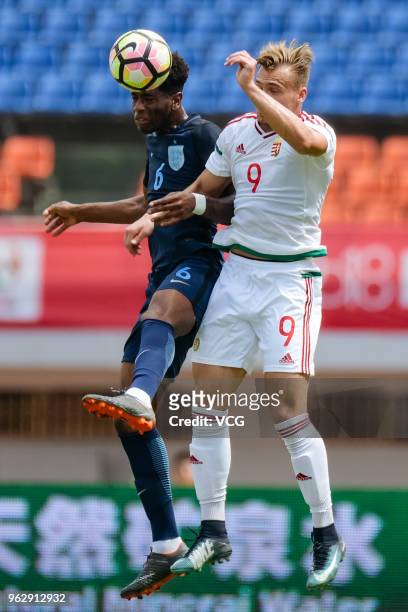 Norman Timari of Hungary and Jonathan Panzo of England jump up to head the ball during the 2018 Panda Cup International Youth Football Tournament...
