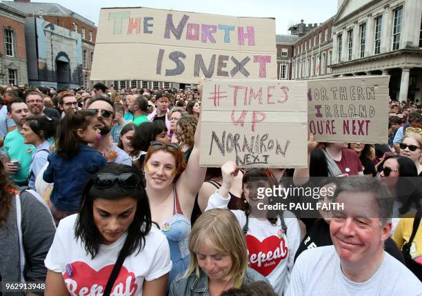 Yes campaigners hold posters calling for British-ruled Northern Ireland to liberalise its strict abortion laws, as campaigners wait for the official...